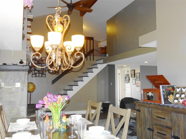 652 Simms Ashuelot Rd, Fort Shaw, MT 59443 - dining area with stairs, a high ceiling, and a notable chandelier