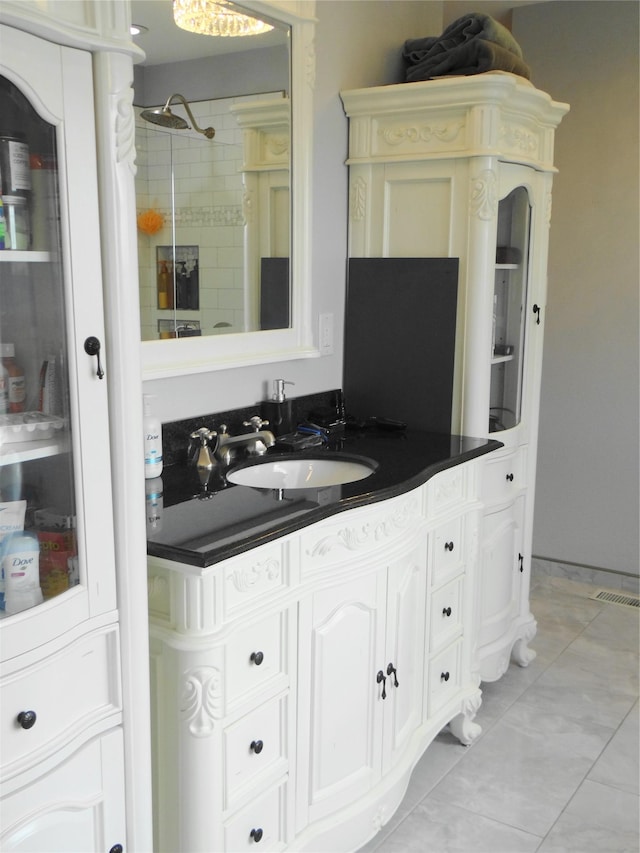 652 Simms Ashuelot Rd, Fort Shaw, MT 59443 - bathroom featuring visible vents, tiled shower, and vanity