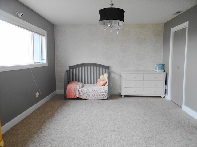 652 Simms Ashuelot Rd, Fort Shaw, MT 59443 - bedroom with visible vents, carpet flooring, baseboards, and a chandelier
