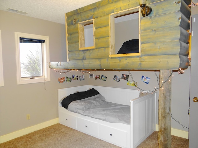 652 Simms Ashuelot Rd, Fort Shaw, MT 59443 - bedroom featuring visible vents, carpet flooring, baseboards, and a textured ceiling
