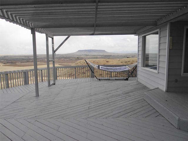 652 Simms Ashuelot Rd, Fort Shaw, MT 59443 - deck featuring a mountain view and a pergola