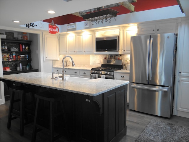 652 Simms Ashuelot Rd, Fort Shaw, MT 59443 - kitchen with a sink, dark wood finished floors, tasteful backsplash, and stainless steel appliances