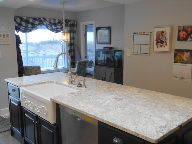 652 Simms Ashuelot Rd, Fort Shaw, MT 59443 - kitchen featuring dark cabinets, light stone counters, and a sink