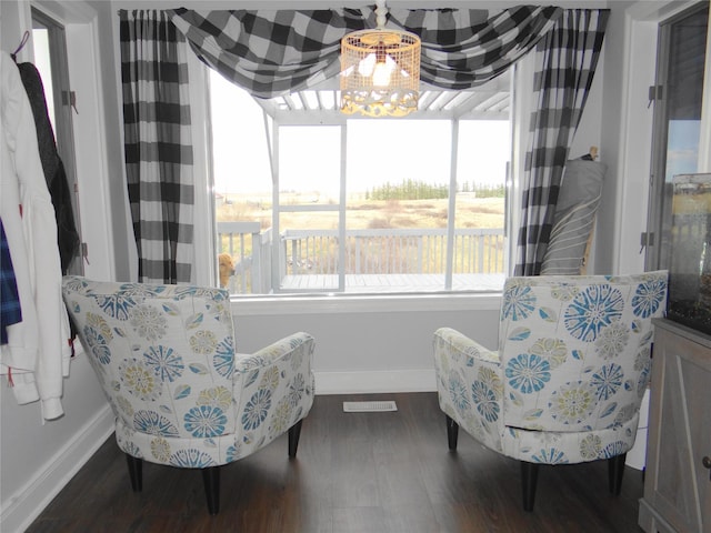 652 Simms Ashuelot Rd, Fort Shaw, MT 59443 - sitting room featuring an inviting chandelier, baseboards, wood finished floors, and visible vents