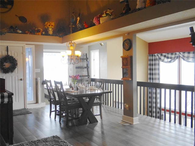 652 Simms Ashuelot Rd, Fort Shaw, MT 59443 - dining room featuring an inviting chandelier, wood finished floors, and a healthy amount of sunlight