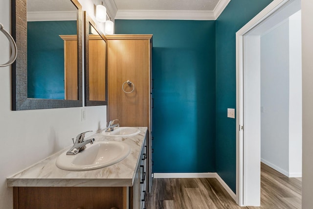 full bathroom with wood finished floors, baseboards, and a sink