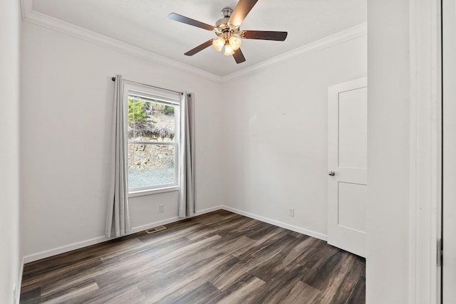 unfurnished room featuring dark wood finished floors, baseboards, visible vents, a ceiling fan, and crown molding