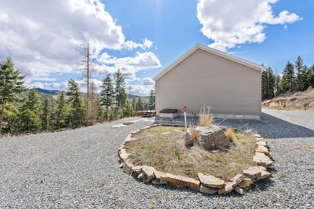 view of side of property featuring crawl space