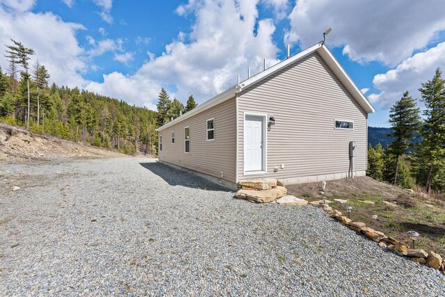 87 Hodge Rdg, Kila, MT 59920 - view of side of property with a wooded view