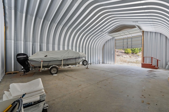 miscellaneous room featuring lofted ceiling and a garage
