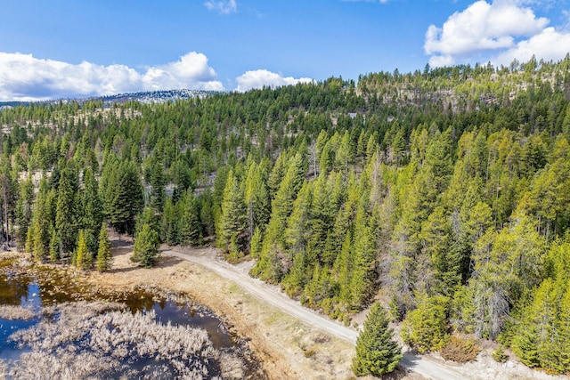 bird's eye view featuring a view of trees