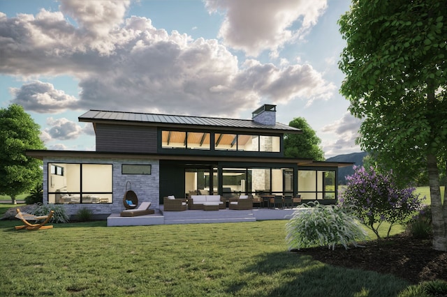 10695 Royal Coachman Dr, Missoula, MT 59808 - rear view of house with outdoor lounge area, a standing seam roof, a lawn, and a chimney