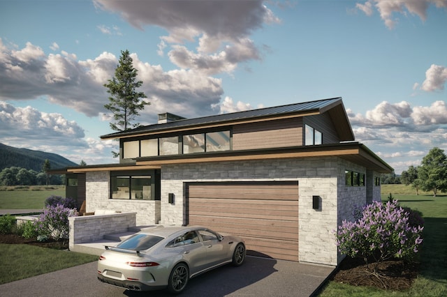 10695 Royal Coachman Dr, Missoula, MT 59808 - view of front of house with a garage, driveway, stone siding, a mountain view, and metal roof