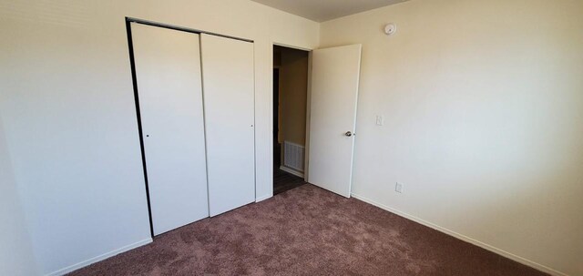1034 Main St, Corvallis, MT 59828 - unfurnished bedroom featuring baseboards, visible vents, a closet, and carpet flooring