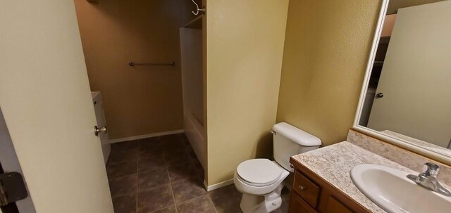 1034 Main St, Corvallis, MT 59828 - bathroom featuring tile patterned floors, toilet, a tub to relax in, walk in shower, and vanity