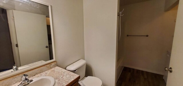 1034 Main St, Corvallis, MT 59828 - full bath with wood finished floors, toilet, and vanity