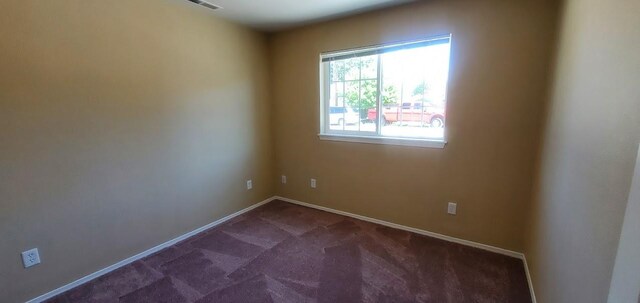 1034 Main St, Corvallis, MT 59828 - spare room featuring carpet floors and baseboards