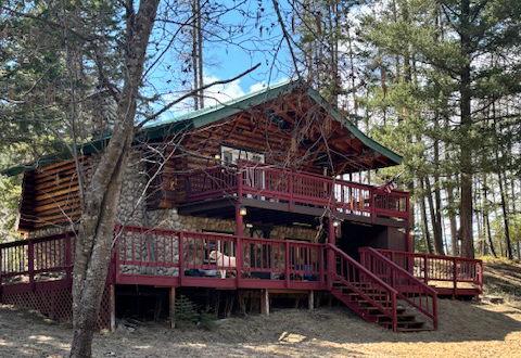 back of house featuring a wooden deck