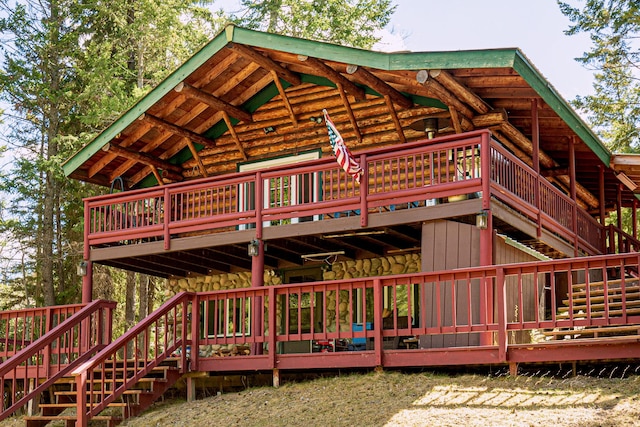 2025 Emmons Canyon Rd, Kila, MT 59920 - back of property with stairs, a deck, and log siding