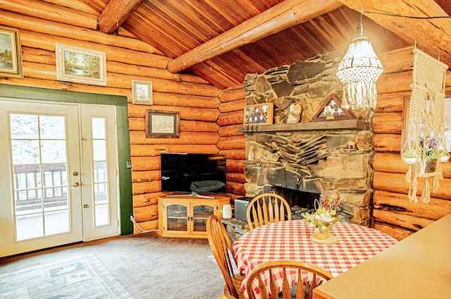 2025 Emmons Canyon Rd, Kila, MT 59920 - carpeted dining room with wood ceiling, a chandelier, rustic walls, and a fireplace