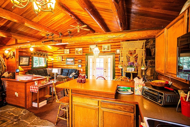 kitchen with wood ceiling, a peninsula, vaulted ceiling with beams, and rustic walls