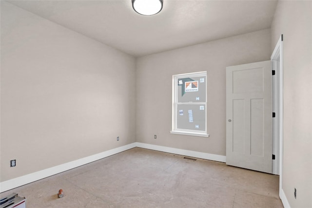 empty room with baseboards