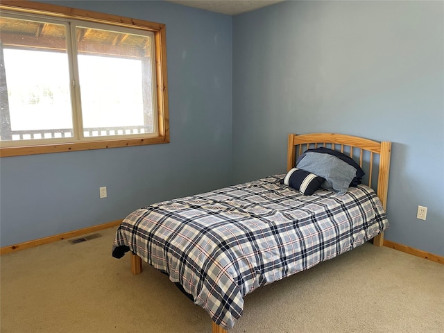 398 Little Beaver Creek Rd, Trout Creek, MT 59874 - carpeted bedroom featuring visible vents and baseboards
