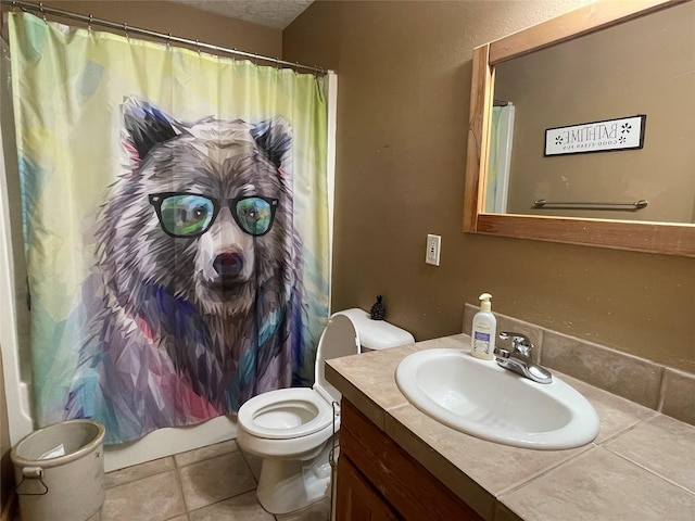 398 Little Beaver Creek Rd, Trout Creek, MT 59874 - bathroom featuring toilet, vanity, and tile patterned floors