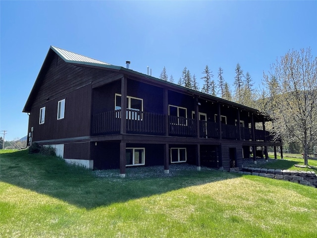 398 Little Beaver Creek Rd, Trout Creek, MT 59874 - rear view of house featuring a lawn and a deck