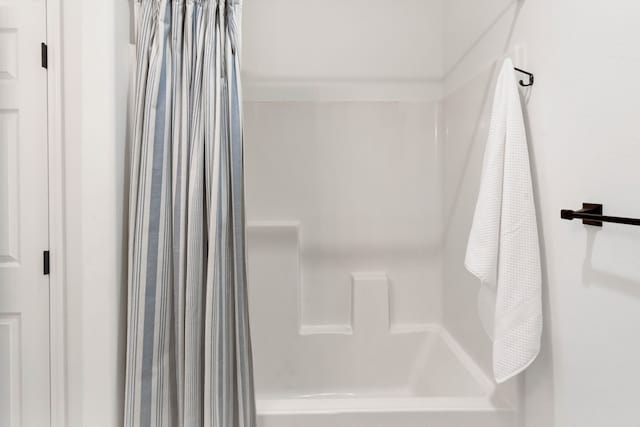 bathroom featuring shower / bathtub combination with curtain