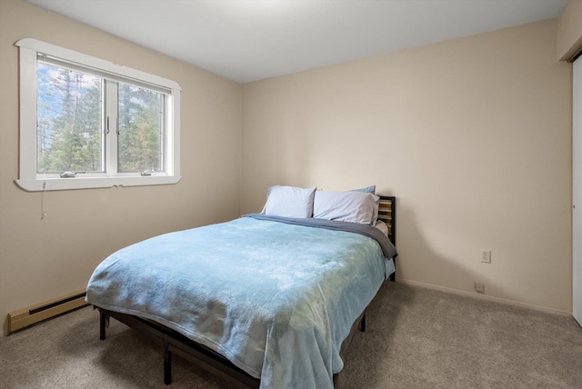 343 Deer Trl, Whitefish, MT 59937 - carpeted bedroom with a baseboard radiator