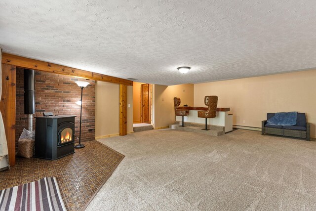 unfurnished room featuring carpet floors, a textured ceiling, and baseboards