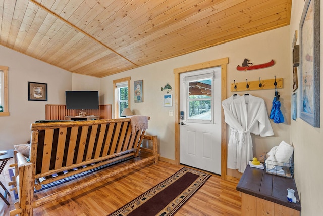 entrance foyer featuring light wood finished floors, lofted ceiling, and wood ceiling