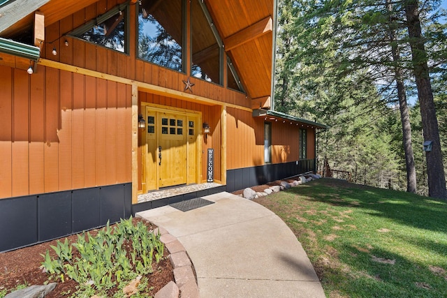 view of side of property with a yard