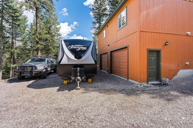 exterior space with gravel driveway