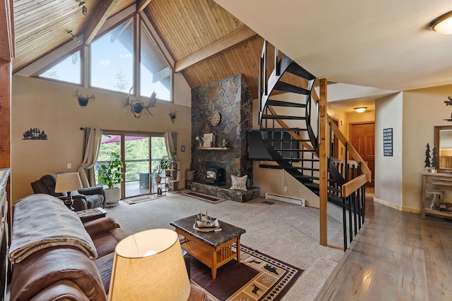 living room featuring beamed ceiling, baseboard heating, stairway, a fireplace, and high vaulted ceiling