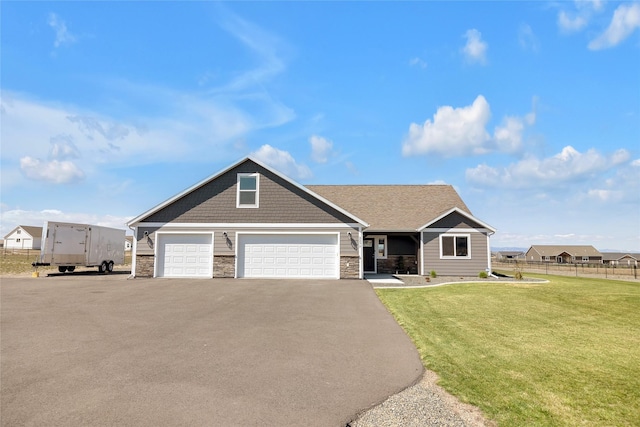 2277 Spring Wheat Loop, East Helena, MT 59635 - craftsman inspired home featuring stone siding, driveway, and an attached garage