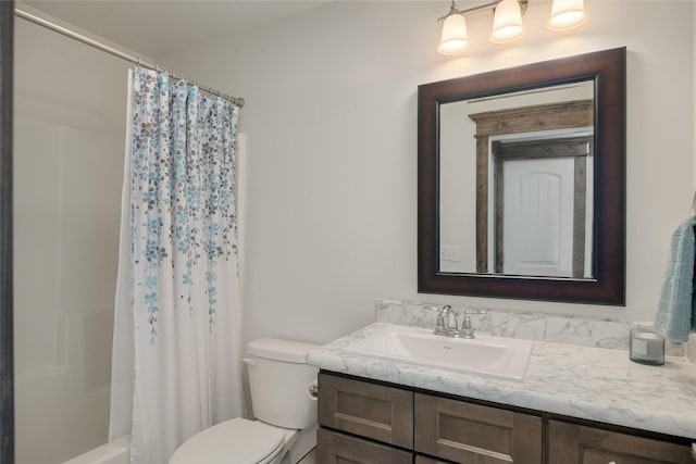 2277 Spring Wheat Loop, East Helena, MT 59635 - bathroom featuring vanity, toilet, and shower / bath combo with shower curtain