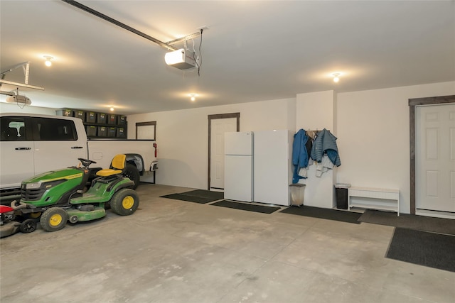 2277 Spring Wheat Loop, East Helena, MT 59635 - garage featuring a garage door opener and freestanding refrigerator
