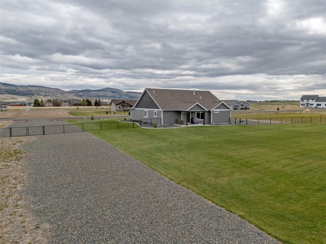 2277 Spring Wheat Loop, East Helena, MT 59635 - view of front of house featuring a mountain view and a patio area