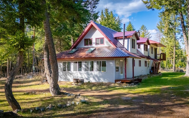 1298 E Mountain Meadow Rd, Kalispell, MT 59901 - back of property featuring a lawn and a metal roof