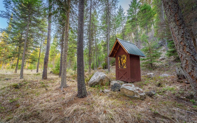 1298 E Mountain Meadow Rd, Kalispell, MT 59901 - view of shed featuring a wooded view