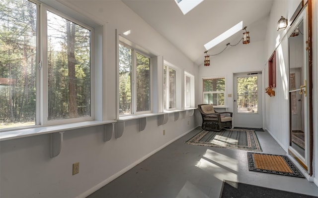 1298 E Mountain Meadow Rd, Kalispell, MT 59901 - sunroom with a skylight, plenty of natural light, concrete flooring, and vaulted ceiling