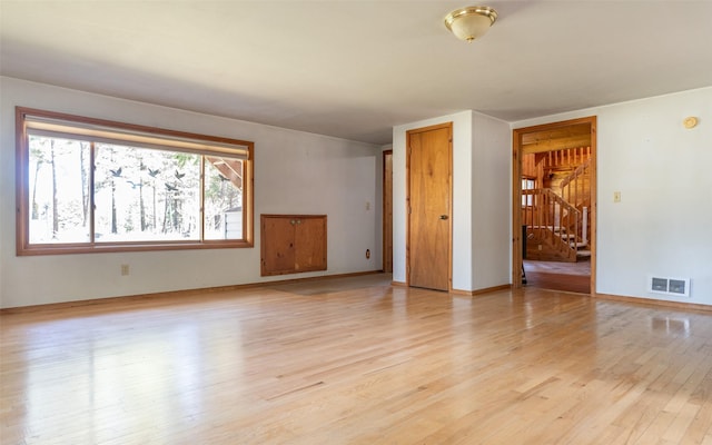 1298 E Mountain Meadow Rd, Kalispell, MT 59901 - empty room with stairway and light wood-style flooring