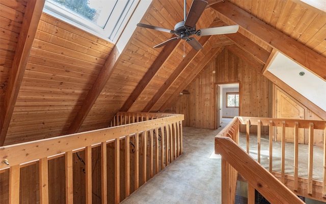 1298 E Mountain Meadow Rd, Kalispell, MT 59901 - corridor with a skylight, wood ceiling, light colored carpet, and wood walls