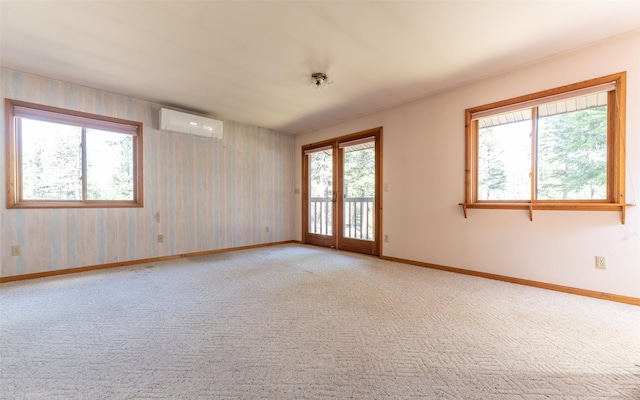 1298 E Mountain Meadow Rd, Kalispell, MT 59901 - empty room featuring an AC wall unit and light colored carpet