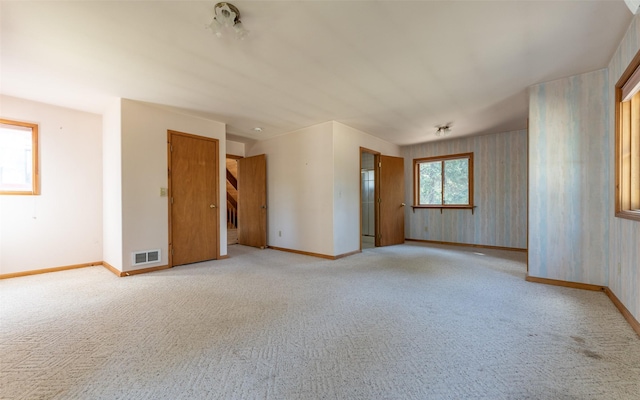 1298 E Mountain Meadow Rd, Kalispell, MT 59901 - spare room with light colored carpet and wallpapered walls