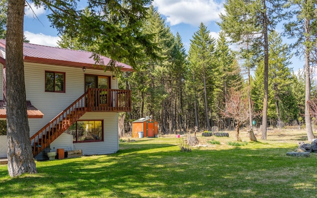 1298 E Mountain Meadow Rd, Kalispell, MT 59901 - view of green lawn featuring a storage unit and stairs