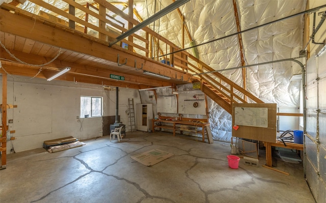 1298 E Mountain Meadow Rd, Kalispell, MT 59901 - garage featuring a wood stove
