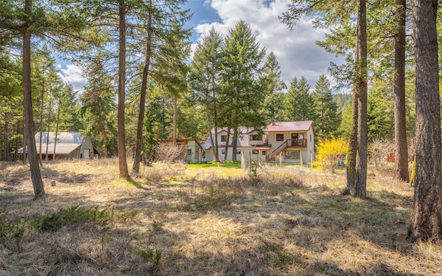 1298 E Mountain Meadow Rd, Kalispell, MT 59901 - view of yard featuring stairway and a deck